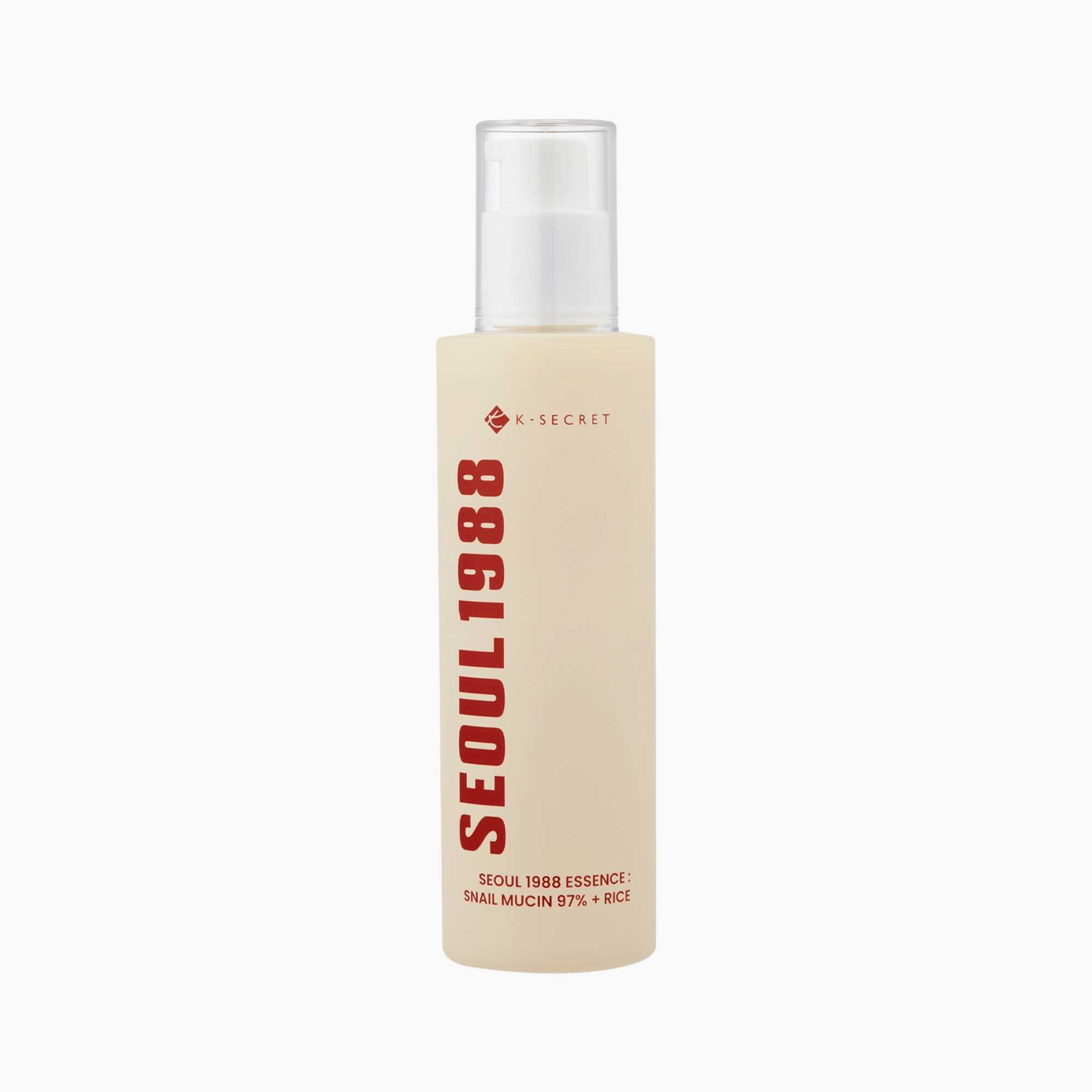 Eine beigefarbene Flasche mit der Aufschrift SEOUL1988 und einem weißen Pumpspender. Sie enthält K-Secret SEOUL 1988 Essence Snail Mucin 97% + Rice 100ml.