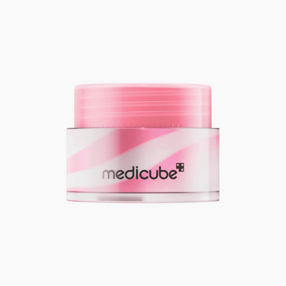 Die Medicube PDRN Lip Sleeping Mask zeigt ein rosa-weißes Wirbelmuster in einem Cremetiegel mit transparentem Deckel vor einem schlichten weißen Hintergrund.